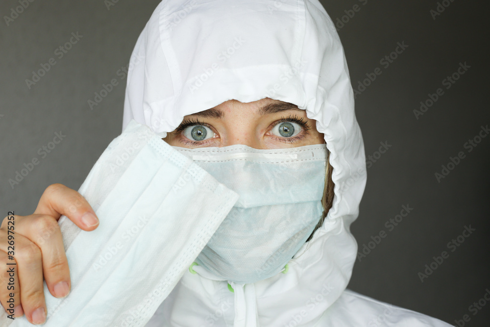 Sick woman wear a medical face mask against virus and protecting herself. Self protection. Sick woman wear a medical face mask against virus and protecting herself. Self protection.
