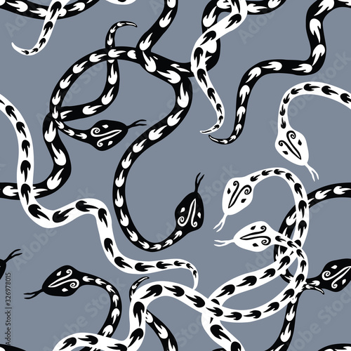 Seamless pattern of creeping decorative black and white snakes
