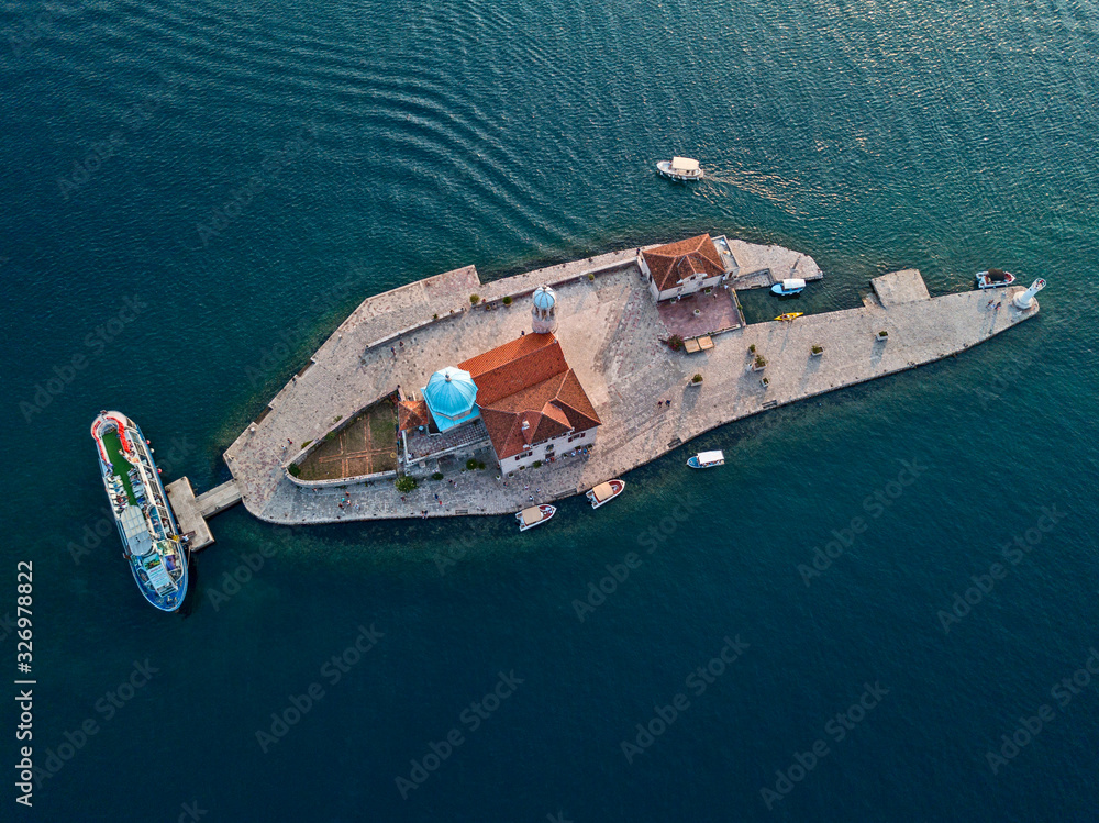 Aerial view of Our Lady of the Rocks is one of the two islets off the coast of Perast in Bay of Kotor, Montenegro. 09-05-2019. Roman Catholic Church