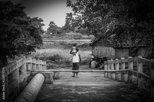 A father caring his son in his shoulder