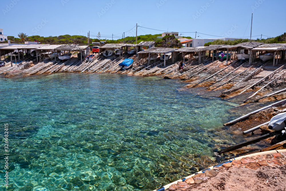 Boats pulled ashore in a port of a fishing village in Formentera in the Balearic islands of Spain.