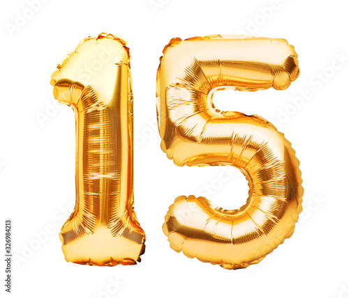 Number 15 fifteen made of golden inflatable balloons isolated on white. Helium balloons, gold foil numbers. Party decoration, anniversary sign for holidays, celebration, birthday, carnival