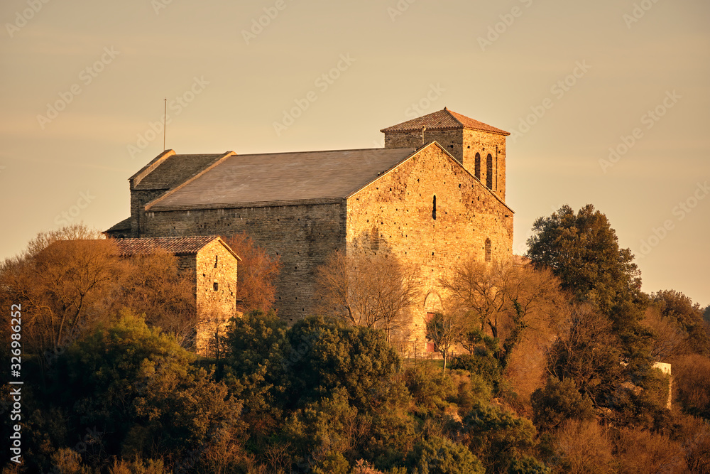 Sunset in monastery illuminated by a soft golden light