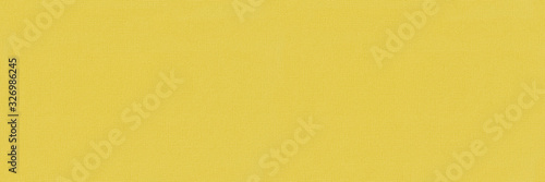 Yellow textured seamless long panoramic abstract background with copy space for text or image.
