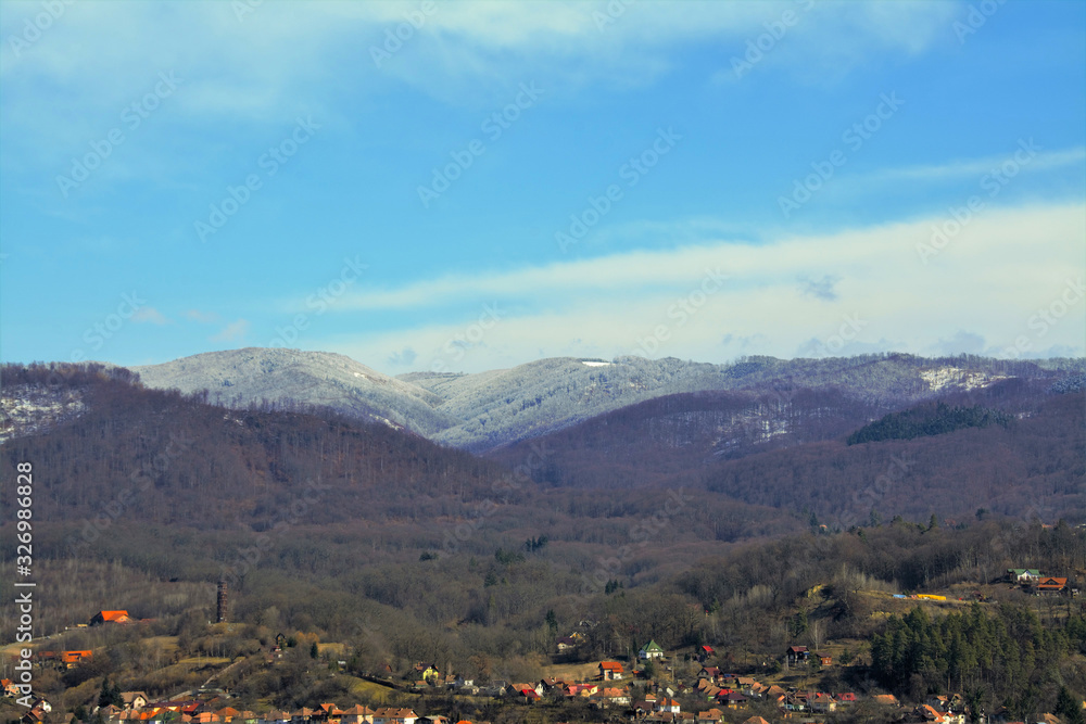 landscape with the top of the mountains covered with snow
