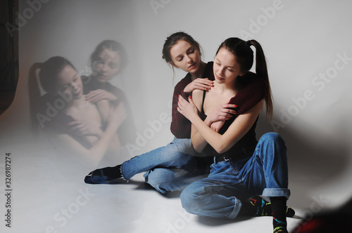 Two gorgeous girl in studio.Fine art.Fashionable. Sensuality. 