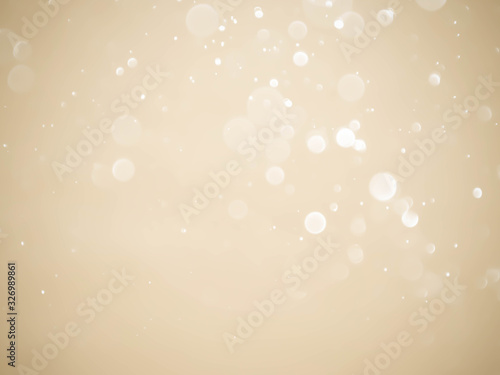 Golden background with soft bokeh lights.
