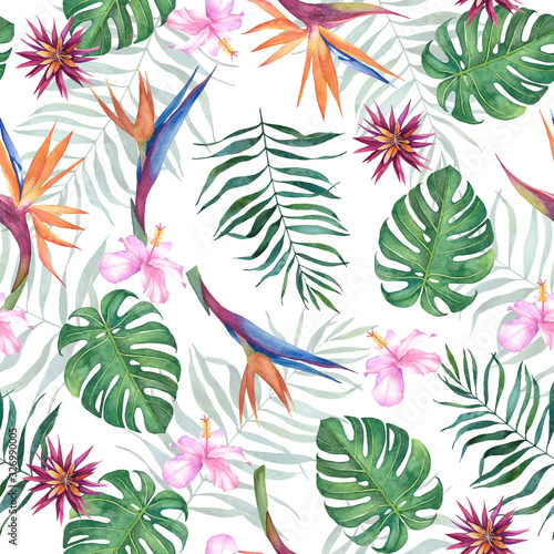 Tropical watercolor seamless pattern with exotic flowers and leaves on a white background.