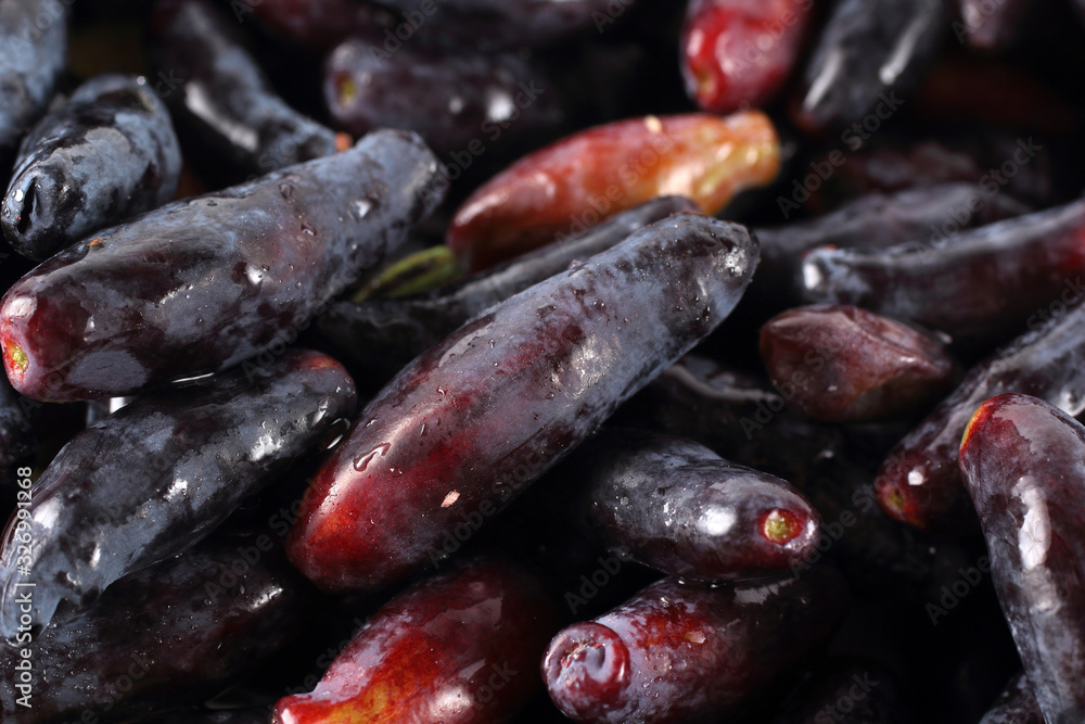 Honeyberries background. Far Eastern delicacy. Macro Honeyberries background. Far Eastern delicacy. Macro