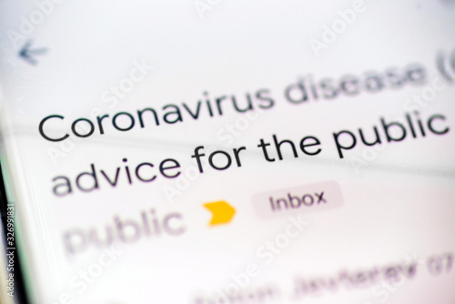 coronavirus disease covid 19 email message on smart phone screen