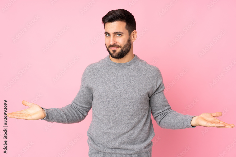 Caucasian handsome man over isolated background having doubts Caucasian handsome man over isolated background having doubts