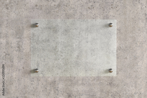 Fotografie Blank horizontal transparent glass sign plate on the concrete wall