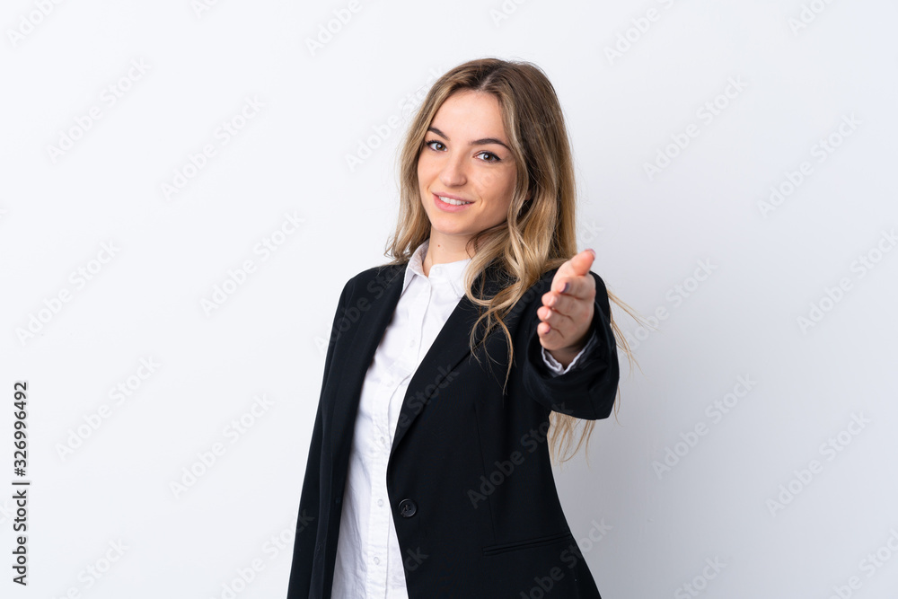 Young business woman over isolated white background handshaking after good deal Young business woman over isolated white background handshaking after good deal