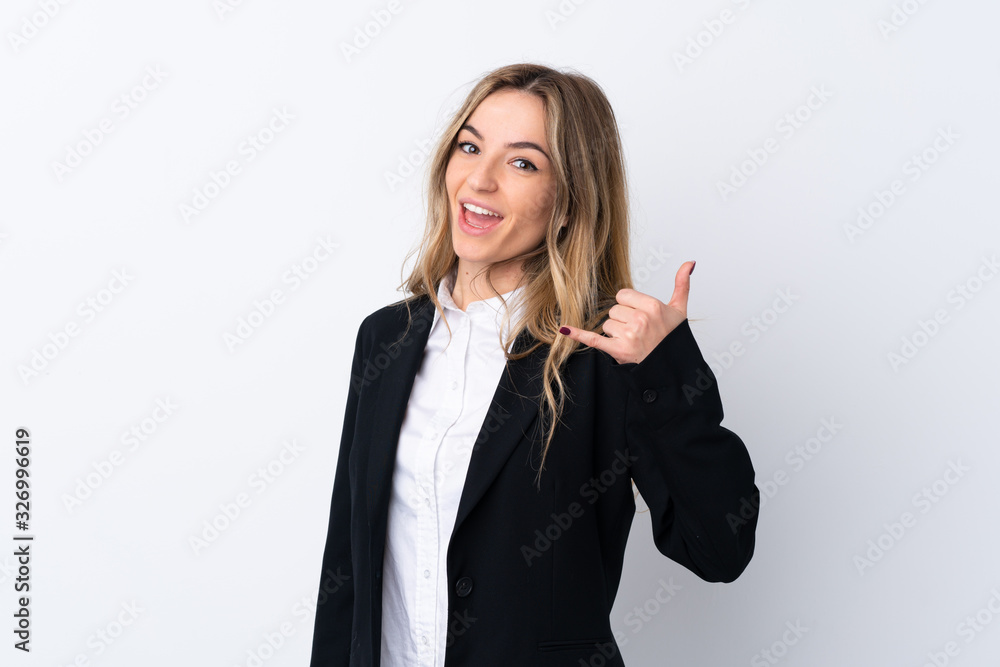 Young business woman over isolated white background making phone gesture Young business woman over isolated white background making phone gesture