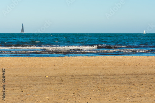 Valencia Beach (Malvarrosa) with two boats in the background