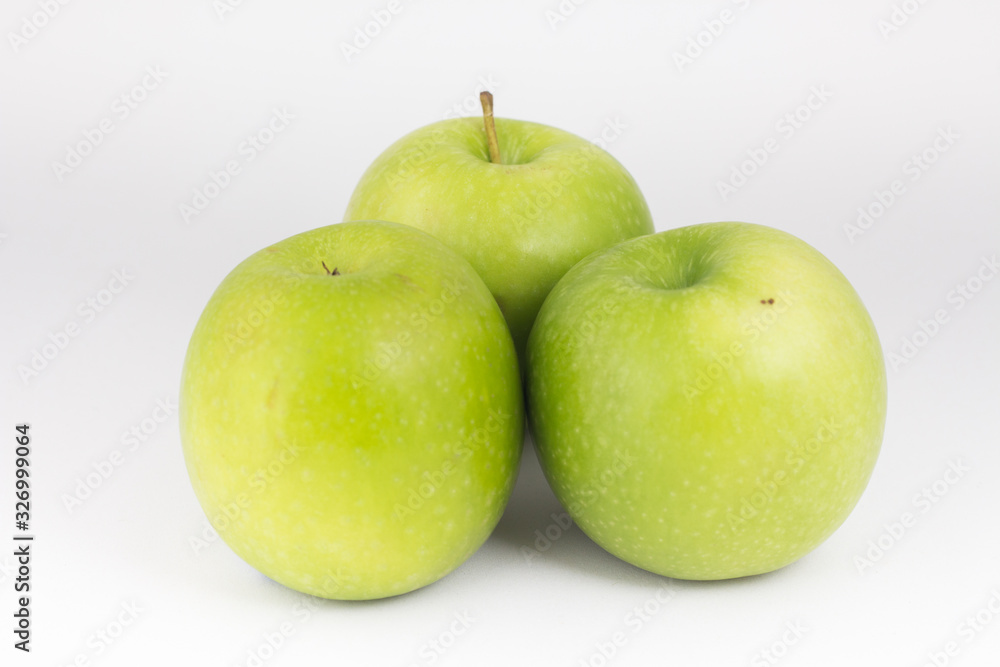 Closed up three green apples on white background. Closed up three green apples on white background.