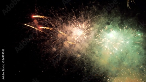 Wallpaper Mural White and yellow green fireworks display on dark sky background. Brightly colorful fireworks on twilight background Torontodigital.ca