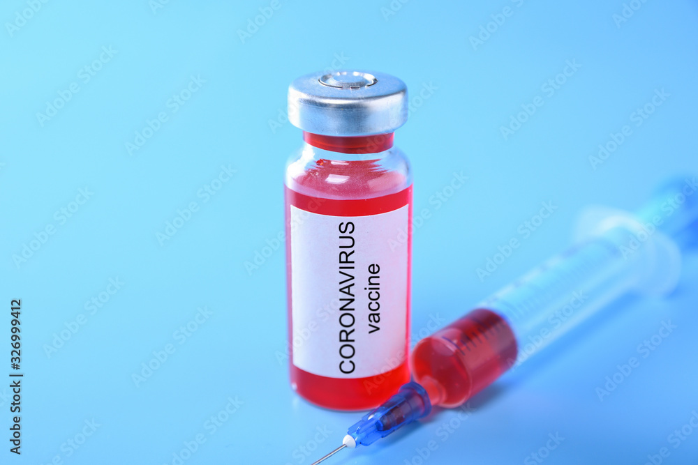 Coronavirus vaccine shot Covid 19 for baby vaccination on blue background, medicine and drug concept Coronavirus vaccine shot Covid 19 for baby vaccination on blue background, medicine and drug concept