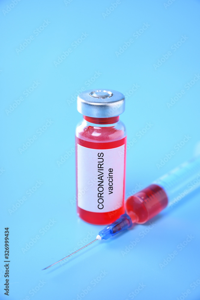 Coronavirus vaccine shot Covid 19 for baby vaccination on blue background, medicine and drug concept Coronavirus vaccine shot Covid 19 for baby vaccination on blue background, medicine and drug concept