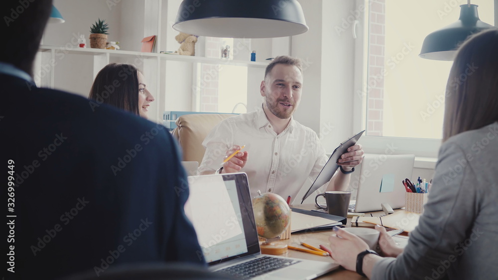 Happy business partners discussion at the table. Confident European young bosses talk and discuss contract terms 4K. Happy business partners discussion at the table. Confident European young bosses talk and discuss contract terms 4K.