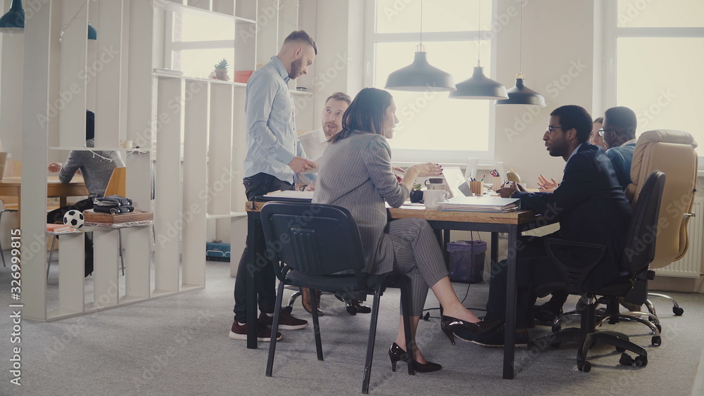 Dolly shot of happy business partners discussion in modern office. Multiethnic bosses collaborate on business project 4K Dolly shot of happy business partners discussion in modern office. Multiethnic bosses collaborate on business project 4K