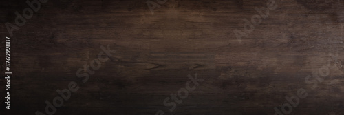 Dark Brown wooden Board background Patterned surface.