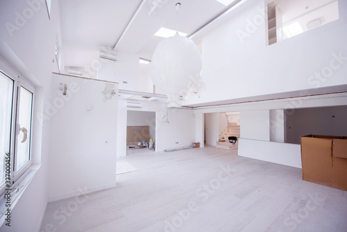 Interior of empty stylish modern open space two level apartment