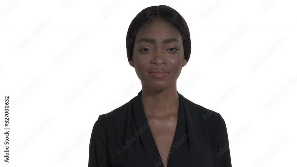 Close-up portrait shot of a woman demonstrating No sign by index finger, rejection body language, gesture concept. Isolated, on white background