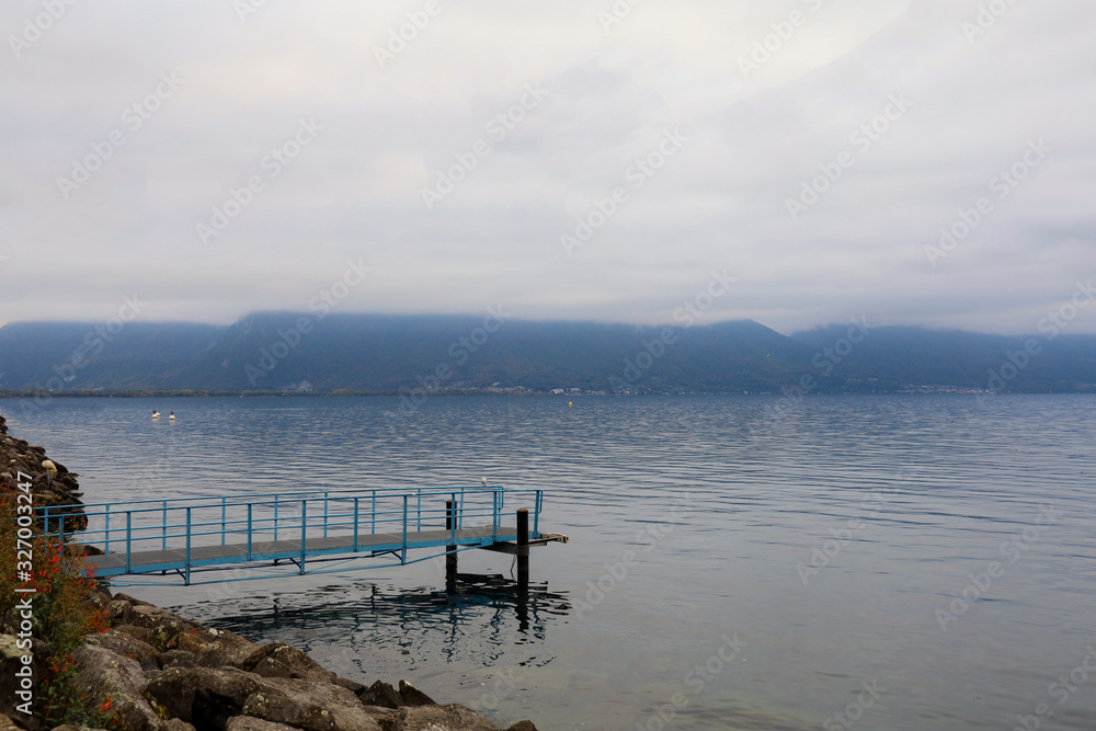 The walkway on water in ganeva lake is beautiful view before sunset at swiss The walkway on water in ganeva lake is beautiful view before sunset at swiss