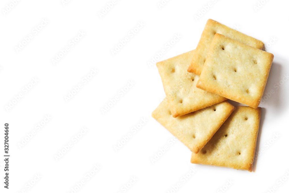 Crispy salty cracker on a white background. Food photo, mockup Crispy salty cracker on a white background. Food photo, mockup