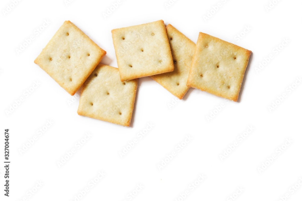 Crispy salty cracker on a white background. Mockup, free space for text