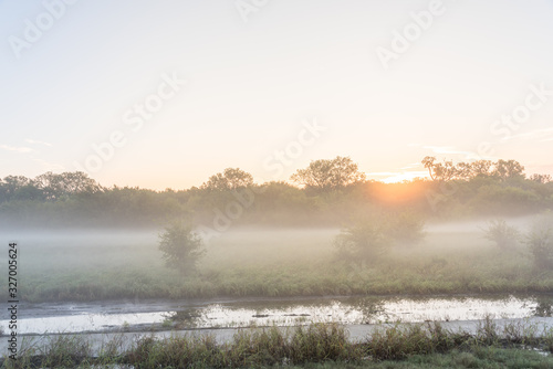 Riverside nature park trail with foggy morning landscape near Dallas, Texas, USA