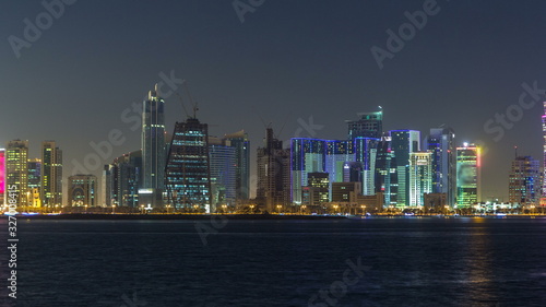 Doha skyscrapers in downtown skyline night timelapse, Qatar, Middle East