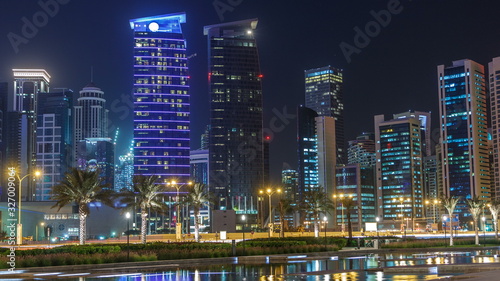 The skyline of Doha by night with starry sky seen from Park timelapse  Qatar