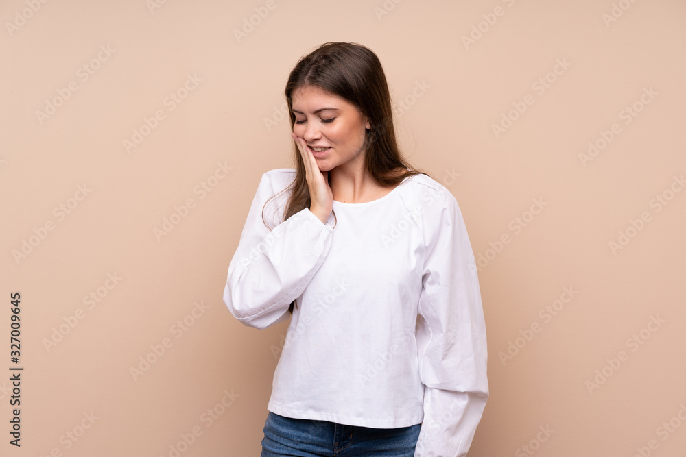 Young girl over isolated background with toothache Young girl over isolated background with toothache