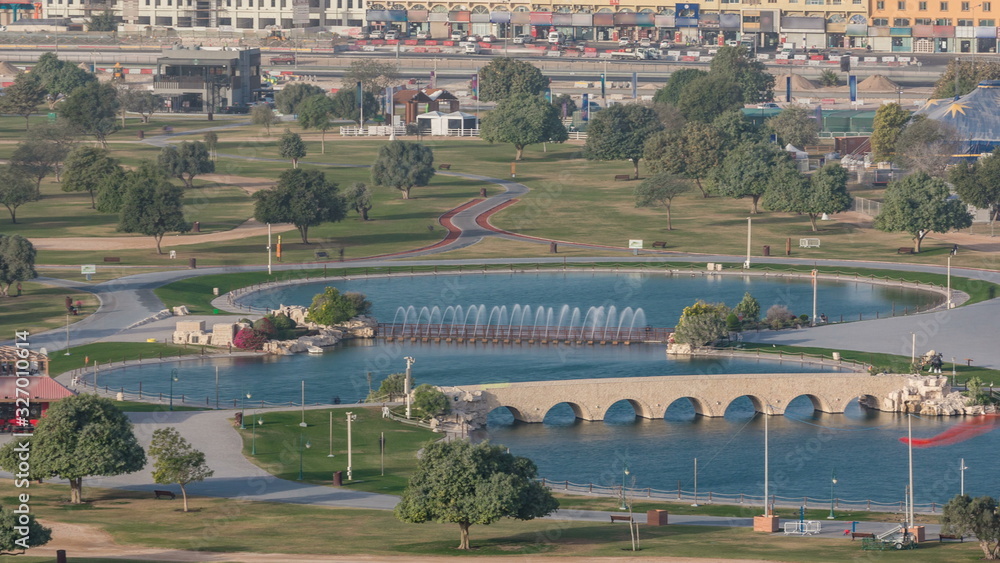 Bridge with fountain and lake in the Aspire park timelapse in Doha, Qatar