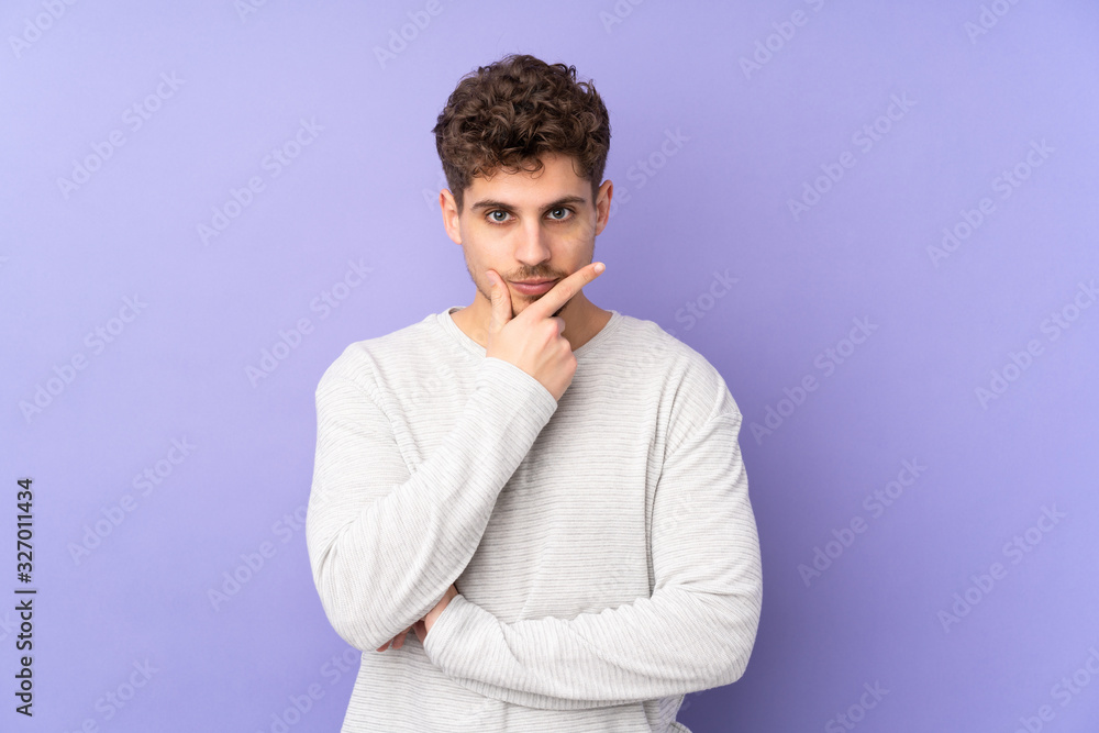 Caucasian man isolated on purple background thinking Caucasian man isolated on purple background thinking