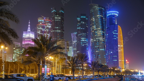 The skyline of Doha by night with starry sky seen from Corniche timelapse, Qatar