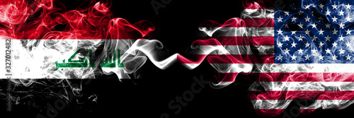 Iraq, Iraqi vs United States of America, American, USA smoky mystic flags placed side by side. Thick colored silky smokes flags together.