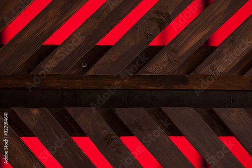 Tableau sur toile Background and texture wooden brown parallel boards on red background