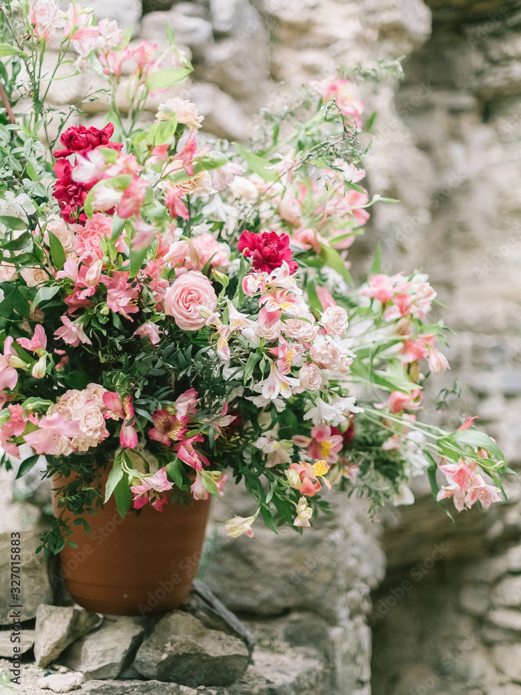 Wedding flowers, bridal bouquet closeup. Decoration made of roses, peonies and decorative plants