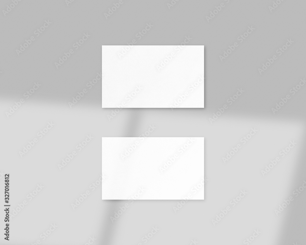 Blank white business cards mockups with soft light and shadow overlays. Mockup scene. Photo mockup with clipping path. Blank white business cards mockups with soft light and shadow overlays. Mockup scene. Photo mockup with clipping path.