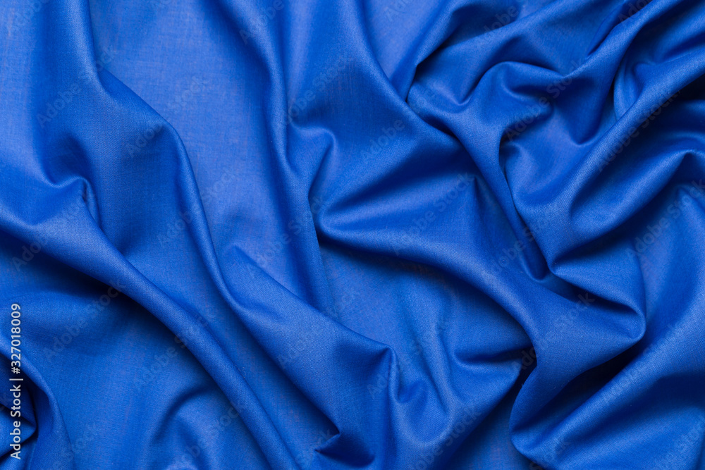 Blue fabric cloth texture. abstract texture background with soft waves. Blue fabric cloth texture. abstract texture background with soft waves.