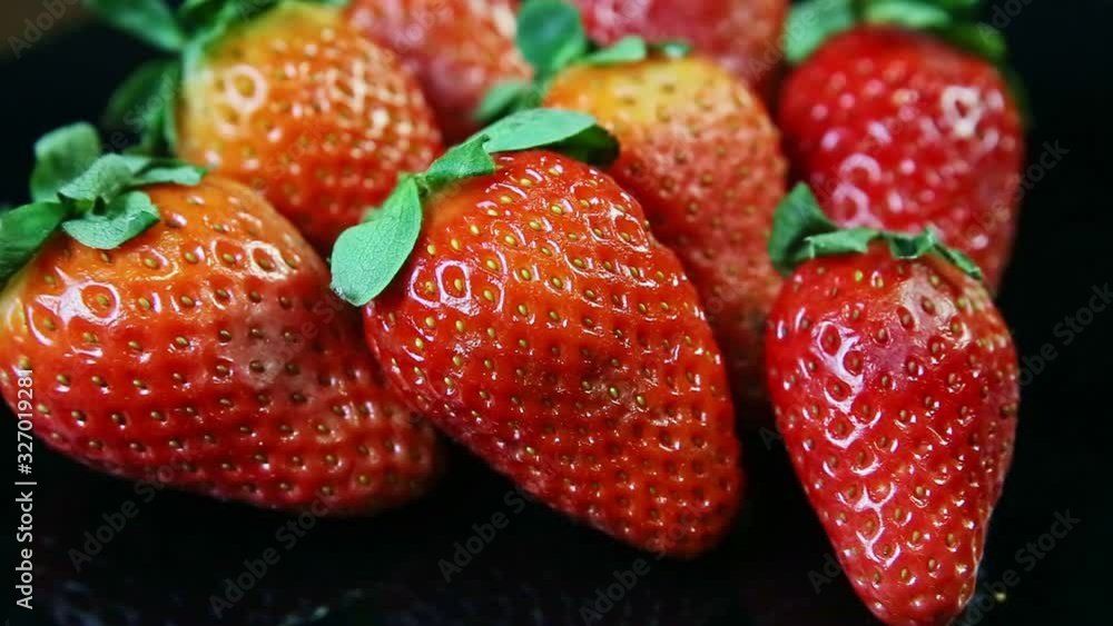 custom made wallpaper toronto digitalmacro view group of whole fresh juicy red strawberries lie on black background