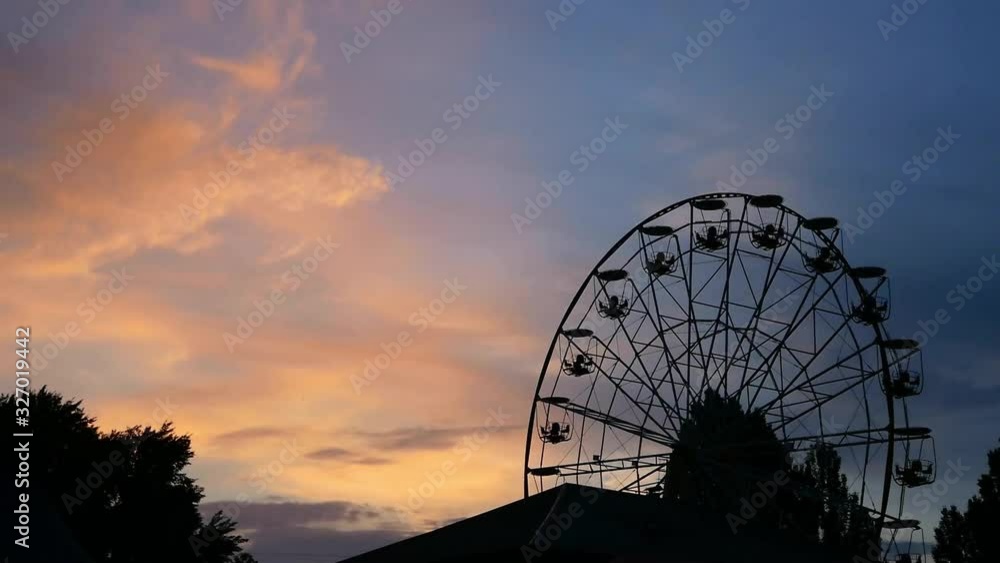 Ferris wheel on night damatic sky, don't move. Beautiful sunst time. Ferris wheel on night damatic sky, don't move. Beautiful sunst time.
