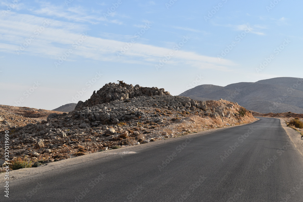 Straight road in the desertic landscape of Mount Lebanon in summer, Faraya, Lebanon