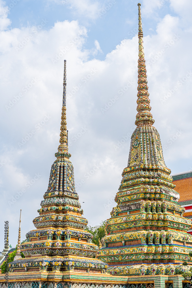 Fototapeta premium The cement pagoda on the outside is decorated with glaze of ceramics. Inside the phra chetuphon wimon mangkararam temple or Thai people call Wat Pho Bangkok, Thailand.