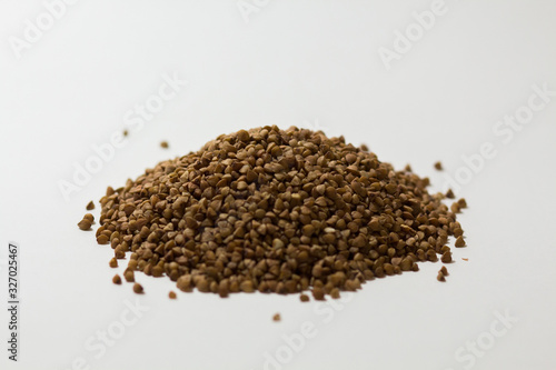 heap of buckwheat on a white background