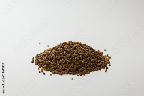 heap of buckwheat on a white background