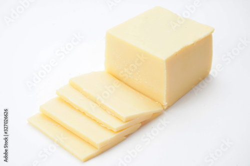 Cheese on a cutting Board isolated on a light background